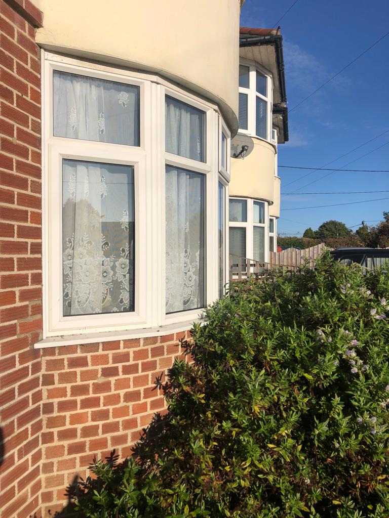 Bay window with white uPVC frames, window cleaning in Lawford