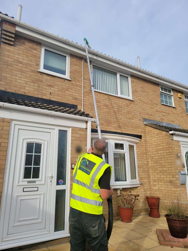 Gutter cleaning with a vacuum pole system, Walton-on-the-Naze