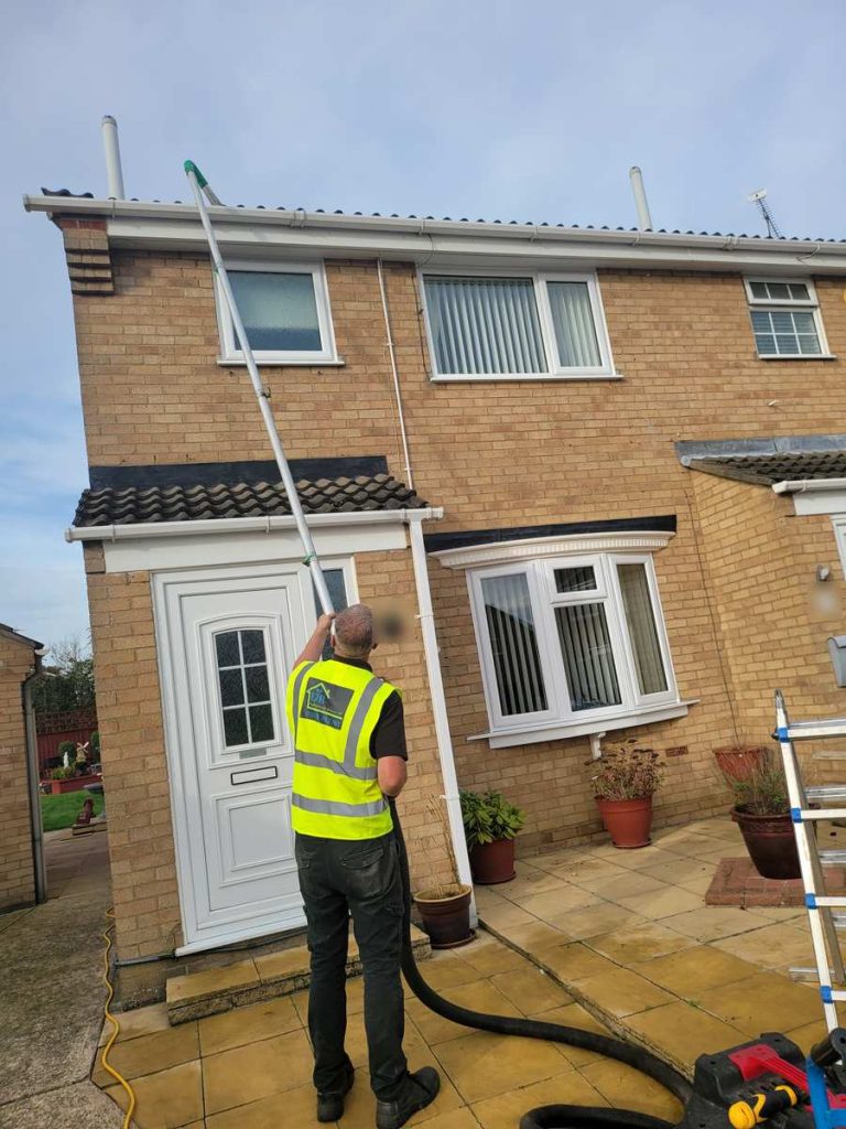 Gutter vacuum system in use at a house in St Osyth